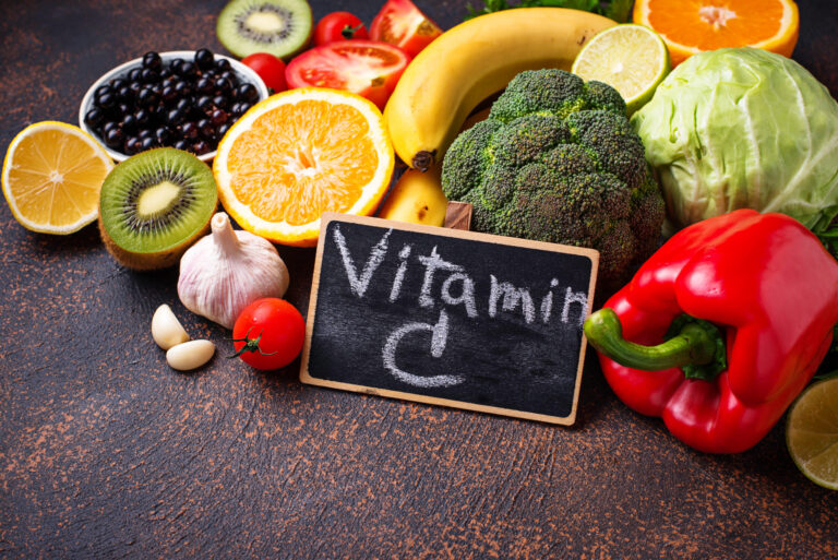 Vitamin C rich foods and produce, including citrus fruits, broccoli, and berries.