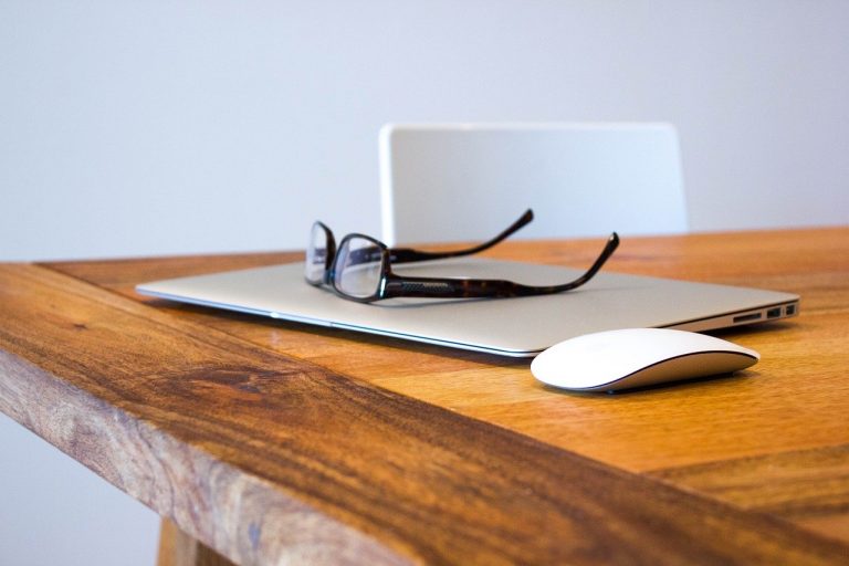 a pair of glasses on a mouse pad