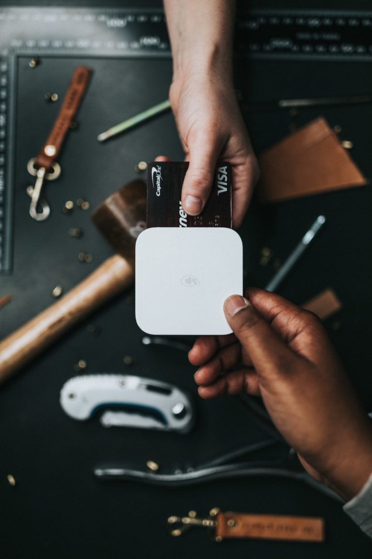 a person holding a piece of electronic equipment