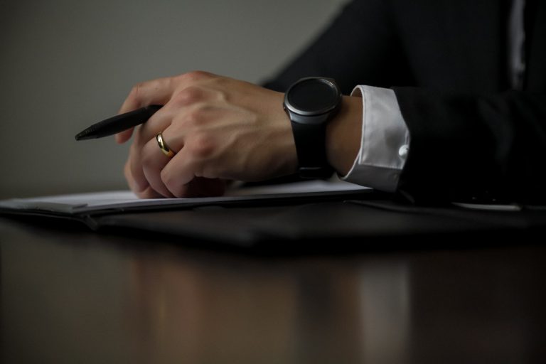 a person writing on a book