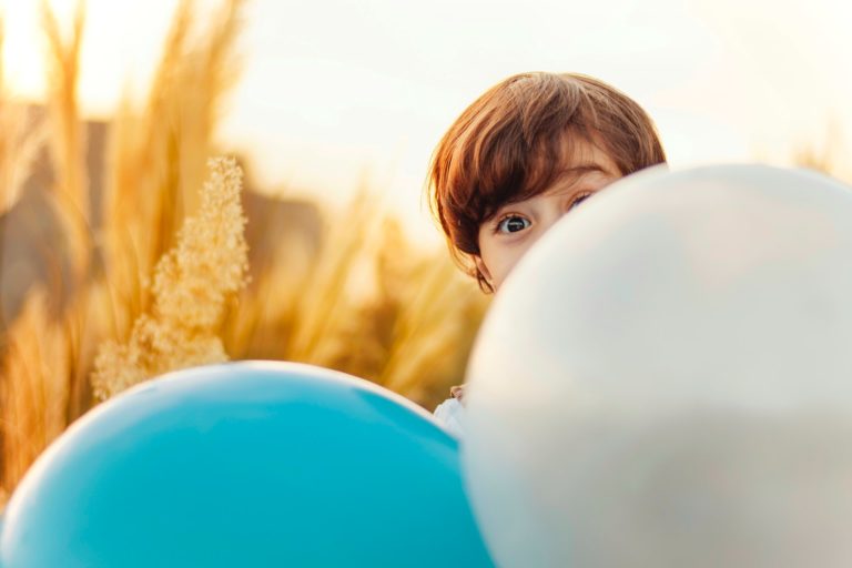 a person looking at a blue object
