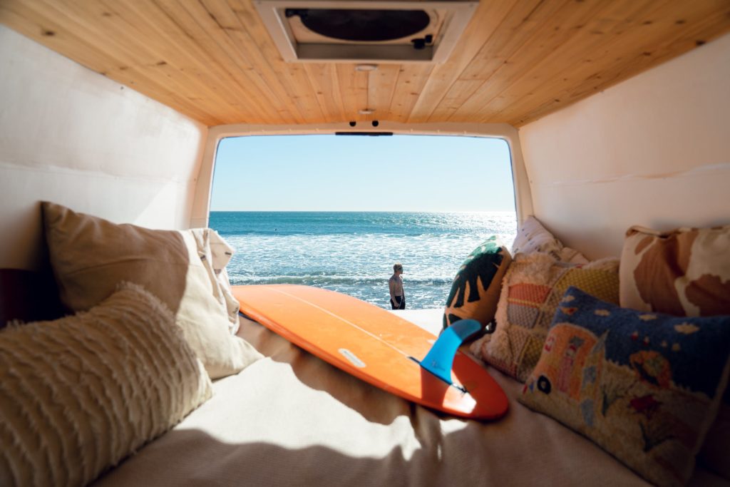 a tent with a beach and a couple of people in it