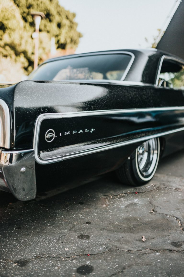 a black car parked on a road