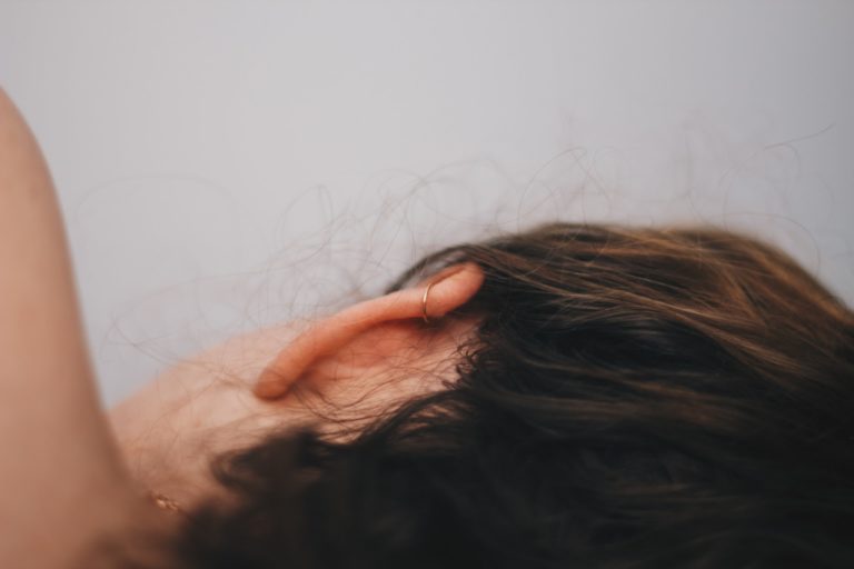 a person's hair being massaged