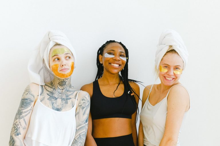 a group of women wearing white masks