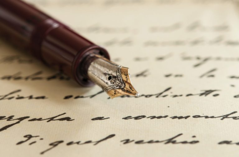 a pen on a piece of paper