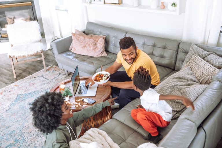 a family sitting on a couch