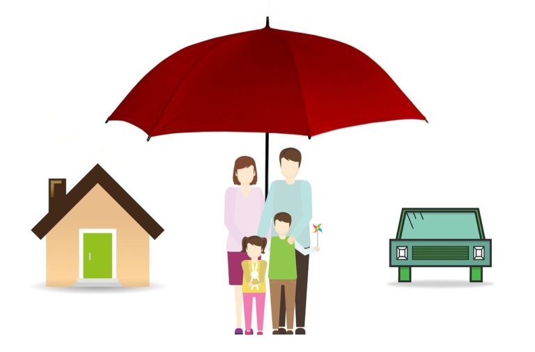 a group of people standing under an umbrella