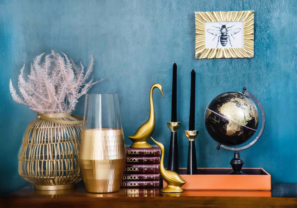 a group of vases and a globe on a table
