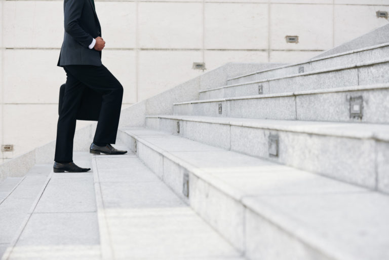 a person walking up a flight of stairs