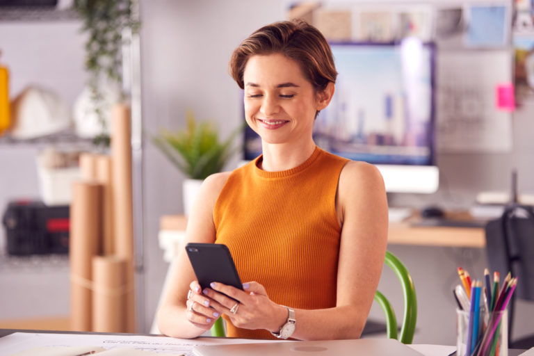 a woman holding a phone