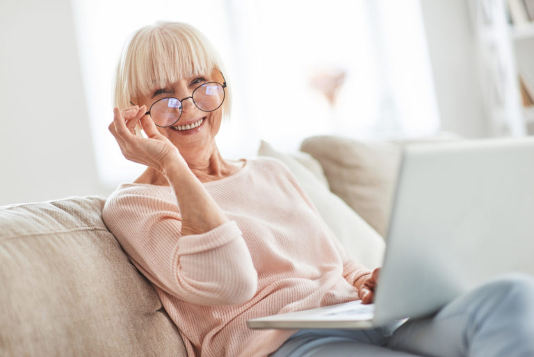 a person holding a laptop